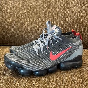 Size 11 Nike Vapormax red and grey mesh athletic shoes. Lightly worn, no damage.
